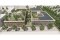 Architekturvisualisierung eines modernen Bürokomplexes mit begrünten Dachflächen, integrierten Photovoltaikanlagen, Terrassenbereichen und umgebender urbaner Landschaft.